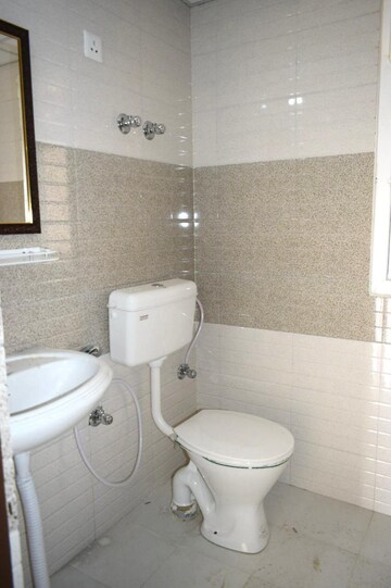 Bathroom in 2 BHK Apartment at Signature Global Orchard Avenue, Sector 93 – for Sale