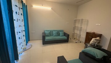 Living Room in 1 BHK Apartment at Godrej Hillside, Mahalunge – for Rent