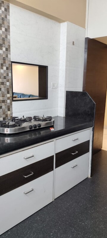Kitchen in 3 BHK Apartment at Whispering Heights, Malad West – for Rent
