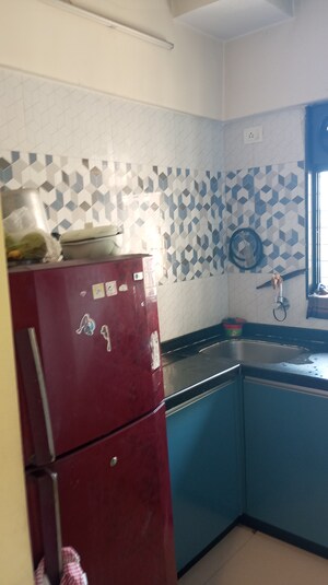 Kitchen in 2 BHK Apartment at Raunak Unnathi Woods Phase 6, Ghodbunder Road – for Sale