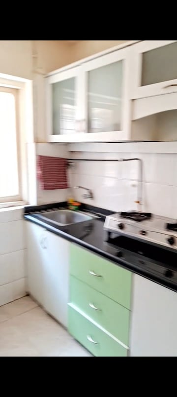Kitchen in 1 BHK Apartment at Aaram Nagar CHS, Versova – for Rent