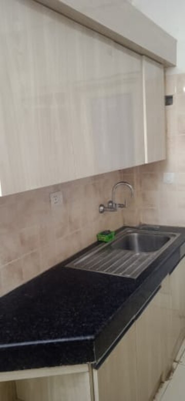 Kitchen in 2.5 BHK Apartment at Ramprastha Awho, Sector 95 – for Sale