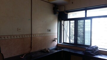 Kitchen in 4 BHK Apartment at Matoshree CHS Vashi, Seawoods – for Rent