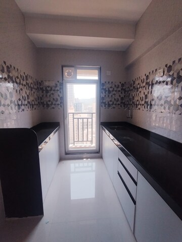 Kitchen in 1 BHK Apartment at Raunak Bliss, Ghodbunder Road – for Rent