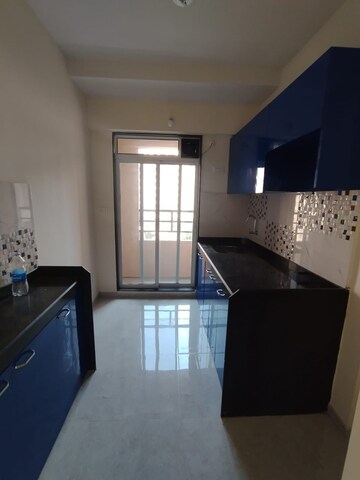 Kitchen in 1 BHK Apartment at Mahavir Kalpavruksha, Ghodbunder Road – for Rent