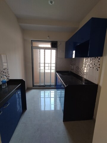 Kitchen in 1 BHK Apartment at Mahavir Kalpavruksha, Ghodbunder Road – for Rent