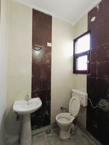 Bathroom in 3 BHK Apartment at Sunny Enclave – for Rent