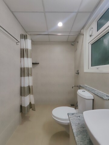 Bathroom in 2 BHK Apartment at Bhartiya Nikoo Homes Phase 2, Thanisandra Main Road – for Sale