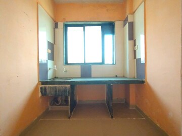 Kitchen in 1.5 BHK Apartment at Nimbeshwar Chs, Vichumbe – for Sale