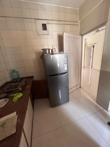 Kitchen in 2 BHK Apartment at Agarsen CHS, Koregaon – for Rent