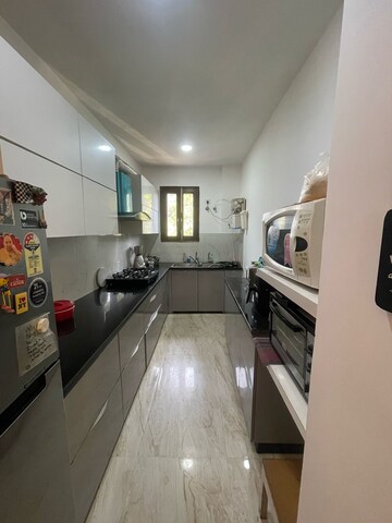 Kitchen in 3 BHK Builder Floor at Ansal Sushant Residency, Sushant Lok Iii – for Sale