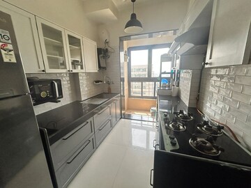 Kitchen in 3 BHK Apartment at Rustomjee OZone, Goregaon West – for Rent