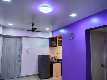 Living Room in 1 BHK Apartment at Lodha Palava Downtown, Dombivli East – for Rent