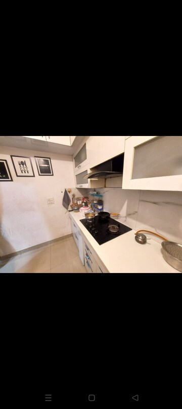 Kitchen in 2 BHK Apartment at Uninav Heights Phase I, Raj Nagar Extension – for Rent