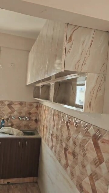 Kitchen in 2 BHK Apartment at Amrapali Golf Homes, Sector 4, Greater Noida – for Rent