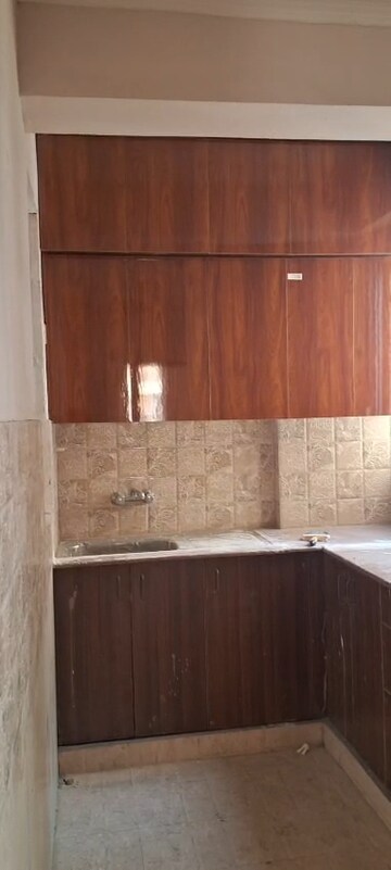 Kitchen in 2 BHK Apartment at Amrapali Golf Homes, Sector 4, Greater Noida – for Rent