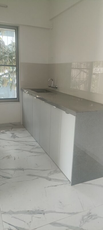 Kitchen in 2 BHK Apartment at Swojas Suman, Law College Road – for Rent