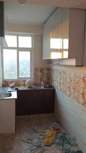 Kitchen in 2 BHK Apartment at Casa Woodstock, Sector 16c Greater Noida – for Rent