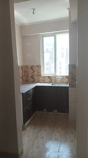 Kitchen in 2 BHK Apartment at Amrapali Golf Homes, Sector 4, Greater Noida – for Rent