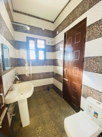 Bathroom in 2 BHK Apartment at Sunny Enclave – for Rent