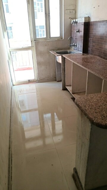 Kitchen in 1 BHK Apartment at SCC Blossom, Raj Nagar Extension – for Sale