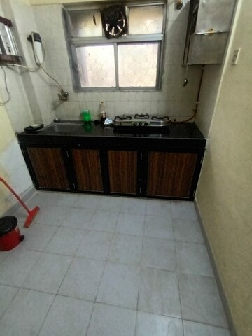 Kitchen in 2 BHK Apartment at Golders Green CHS, Borivali West – for Rent