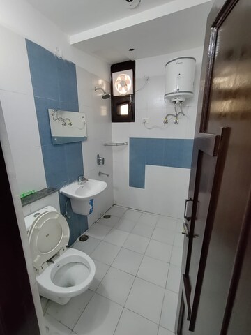 Bathroom in 1 RK Apartment at Dhakoli Village – for Rent