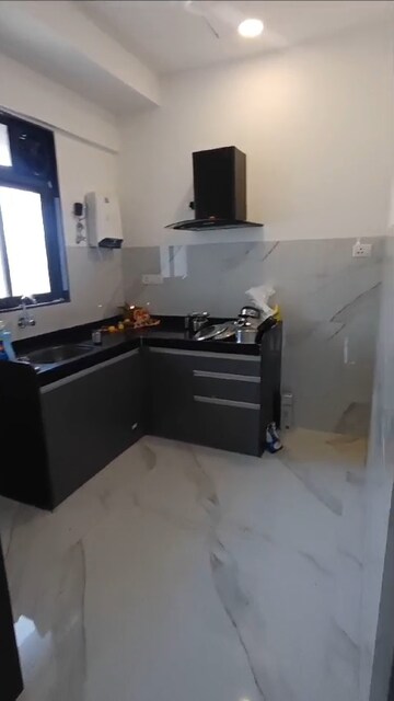 Kitchen in 2 BHK Apartment at Dev Leo Tower, Oshiwara – for Rent
