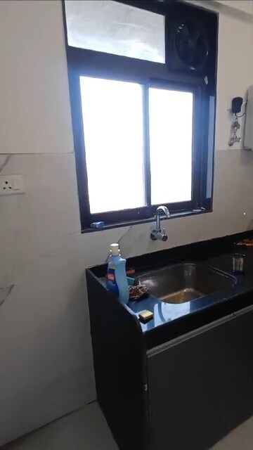 Kitchen in 2 BHK Apartment at Dev Leo Tower, Oshiwara – for Rent