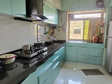 Kitchen in 1 BHK Apartment at Rajaram Sukur Sapphire, Ghodbunder Road – for Sale