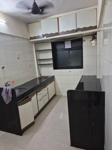 Kitchen in 3 BHK Apartment at Charkop Priya CHS, Kandivali West – for Rent