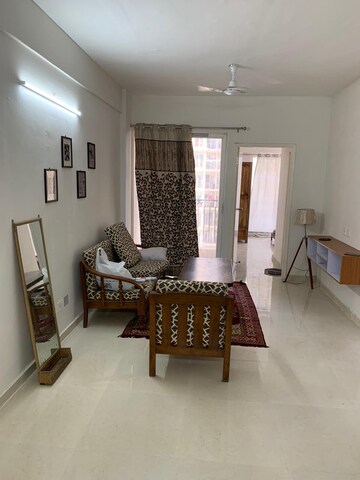 Living Room in 2 BHK Apartment at Signature Global Orchard Avenue, Sector 93 – for Rent
