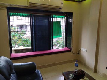 Living Room in 2 BHK Apartment at Anushka CHS, Andheri West – for Rent