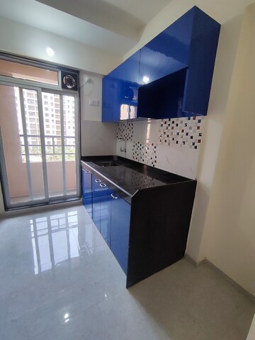 Kitchen in 1 BHK Apartment at Mahavir Kalpavruksha, Ghodbunder Road – for Rent