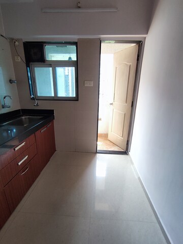 Kitchen in 1 BHK Apartment at Raunak Bliss, Ghodbunder Road – for Rent