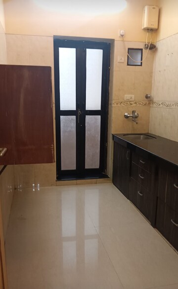 Kitchen in 1 BHK Apartment at K Raheja Heights, Malad East – for Rent