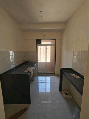 Kitchen in 1 BHK Apartment at Damji Shamji Mahavir Kalpavruksha Wing J Phase 2, Kasarvadavali – for Rent