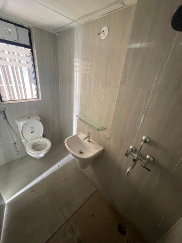 Bathroom in 1 BHK Apartment at Runwal Gardens, Dombivli East – for Rent