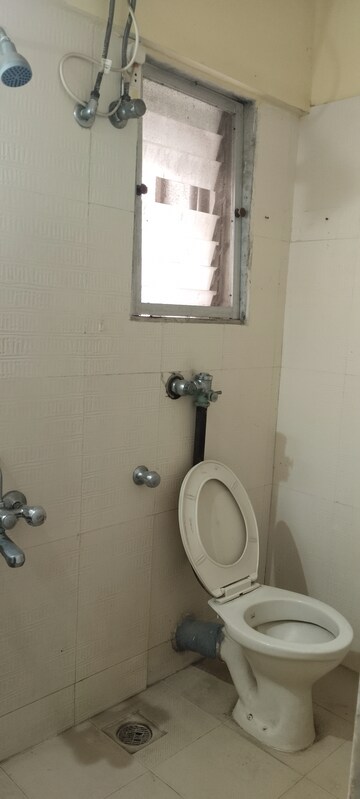 Bathroom in 2 BHK Apartment at Laxmi Royal Classic, Mulund West – for Rent