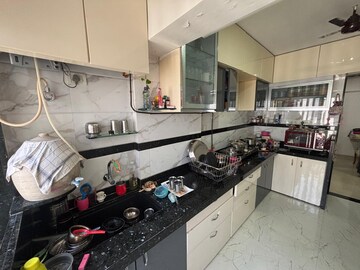 Kitchen in 2.5 BHK Apartment at Aims Golf City, Sector 75 – for Sale