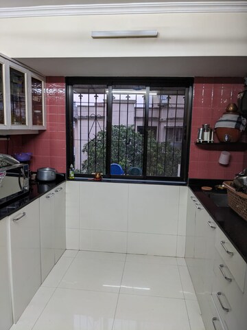 Kitchen in 2.5 BHK Apartment at Aims Golf City, Sector 75 – for Sale
