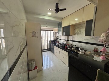Kitchen in 2.5 BHK Apartment at Aims Golf City, Sector 75 – for Sale