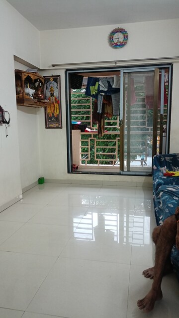 Living Room in 1 BHK Apartment at Pranjee Garden City Phase 2, Katrap – for Rent