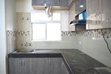 Kitchen in 2 BHK Apartment at Signature Global Orchard Avenue, Sector 93 – for Rent