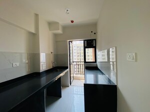 Kitchen in 1.5 BHK Apartment at Runwal Gardens, Dombivli East – for Sale