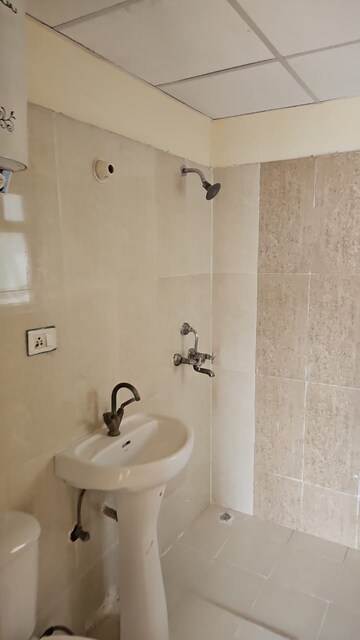 Bathroom in 2 BHK Apartment at Antriksh Golf View, Sector 78 – for Rent