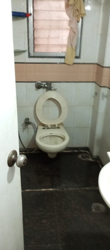 Bathroom in 2 BHK Apartment at Sai Baba Enclave, Goregaon West – for Rent