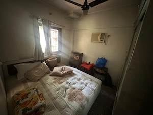 Bedroom in 3 BHK Apartment at Orchid Enclave CHS, Andheri East – for Sale