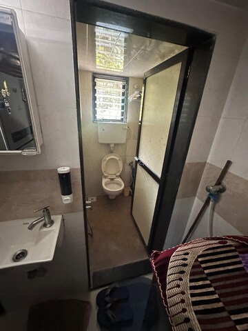 Bathroom in 3 BHK Apartment at Orchid Enclave CHS, Andheri East – for Sale