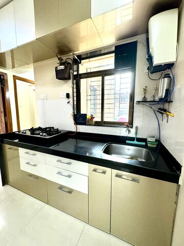 Kitchen in 1.5 BHK Apartment at Shree Satya Shankar Residency, Manpada – for Sale